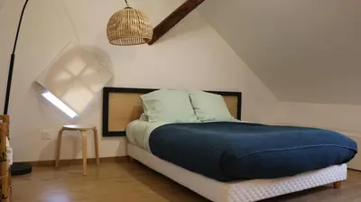 Un ou plusieurs lits dans un hébergement de l'établissement Le duplex des Marchands