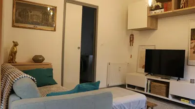 Télévision ou salle de divertissement dans l'établissement Le duplex des Marchands