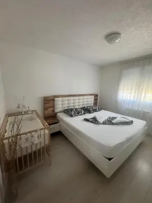 Un ou plusieurs lits dans un hébergement de l'établissement Maison de vacances