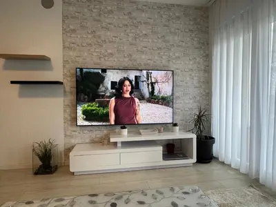 Télévision ou salle de divertissement dans l'établissement Maison de vacances