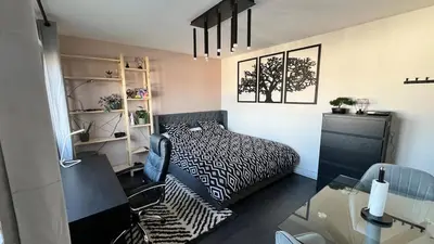 Un ou plusieurs lits dans un hébergement de l'établissement Appartement cosy