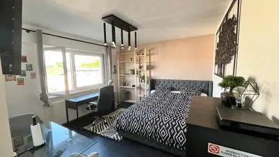 Un ou plusieurs lits dans un hébergement de l'établissement Appartement cosy