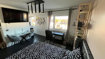 Télévision ou salle de divertissement dans l'établissement Appartement cosy