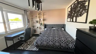Un ou plusieurs lits dans un hébergement de l'établissement Appartement cosy