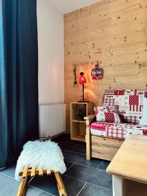 Coin salon dans l'établissement Appartement à La Bresse - cadre naturel et calme
