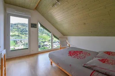 Un ou plusieurs lits dans un hébergement de l'établissement Chalet de la Lunelle