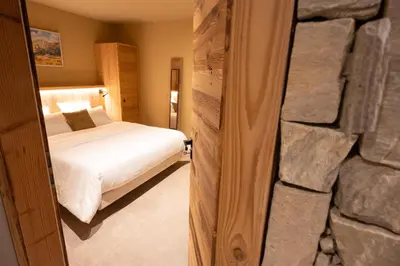 Un ou plusieurs lits dans un hébergement de l'établissement Le Chalet Vosges Alsace - La Petite Ferme 4 étoiles
