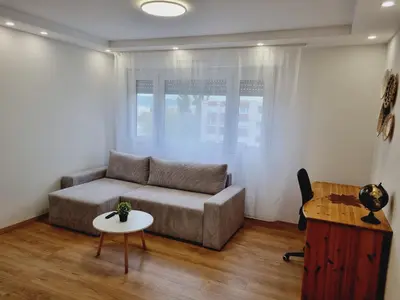 Coin salon dans l'établissement Appartement moderne Treeland - Basel - Airport