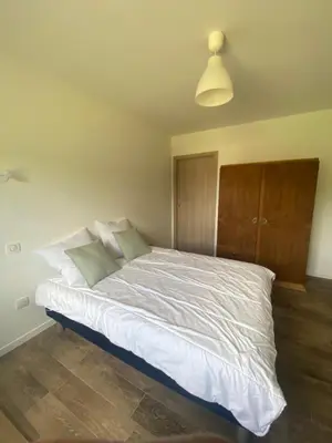 Un ou plusieurs lits dans un hébergement de l'établissement Coquette maison neuve de plain pied au cœur des Hautes Vosges,