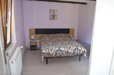 Un ou plusieurs lits dans un hébergement de l'établissement Appartement 6 personnes dans maison alsacienne