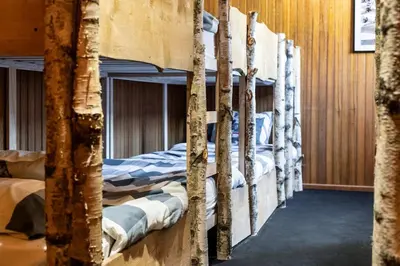 Un ou plusieurs lits dans un hébergement de l'établissement Villa - Détente & Jacuzzi aux portes de Gérardmer