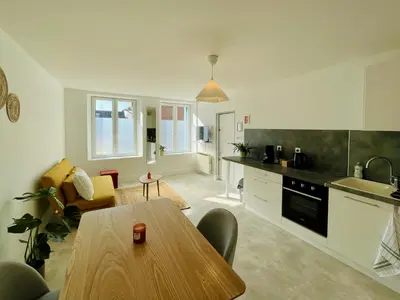 Cuisine ou kitchenette dans l'établissement Charmant appartement en rez-de-chaussée