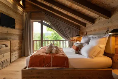 Un ou plusieurs lits dans un hébergement de l'établissement Chalet Le Cocon des Marmottes