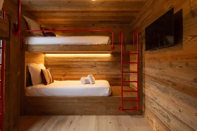 Un ou plusieurs lits dans un hébergement de l'établissement Chalet Le Cocon des Marmottes