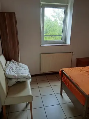 Un ou plusieurs lits dans un hébergement de l'établissement Chambre room in appartement