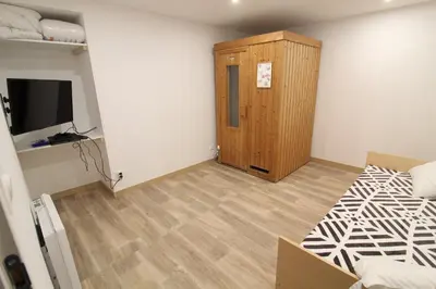 Un ou plusieurs lits dans un hébergement de l'établissement Appartement tout confort à Gérardmer avec sauna, proche du lac et des commerces