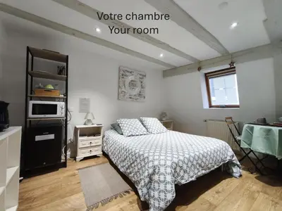 Un ou plusieurs lits dans un hébergement de l'établissement Chambre chez l'habitant - Centre historique - Salle d'eau et WC privés