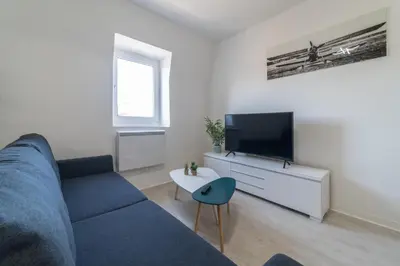 Télévision ou salle de divertissement dans l'établissement Le Sweet Duplex