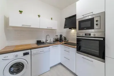 Cuisine ou kitchenette dans l'établissement Le Sweet Duplex