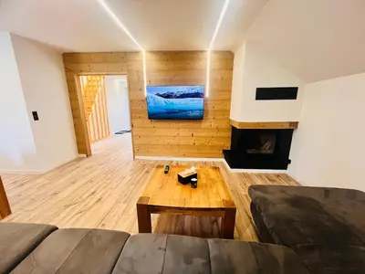 Coin salon dans l'établissement Duplex cosy proche Gérardmer