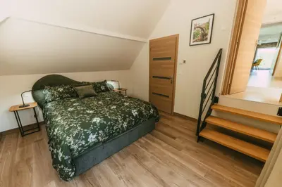 Un ou plusieurs lits dans un hébergement de l'établissement Gîte LEHA avec jacuzzi à RimbachZell pour 5 personnes