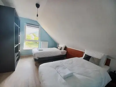 Un ou plusieurs lits dans un hébergement de l'établissement Maison neuve 4 chambres à Soulzbach - FR-1-744-46