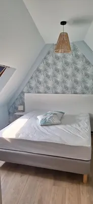 Un ou plusieurs lits dans un hébergement de l'établissement Gîte ramloc