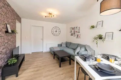 Coin salon dans l'établissement MonSéjourCosy - L'Urban - Cosy - Netflix