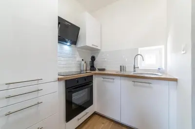 Cuisine ou kitchenette dans l'établissement Le Sweet Plaisancier - Parking and Wi-Fi Gratuits-