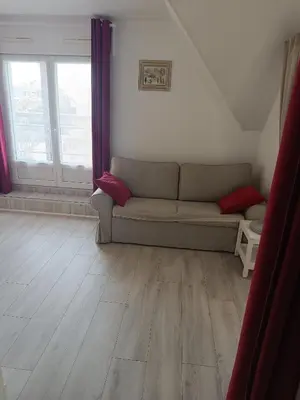 Coin salon dans l'établissement Appartement centre ville avec parking