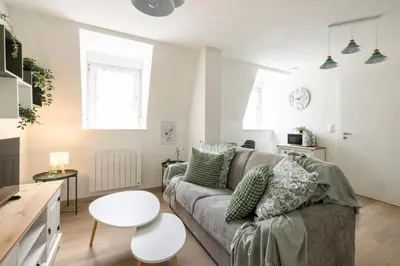 Coin salon dans l'établissement MonSéjourCosy - Le Cottage - Studio - Cosy - Netflix