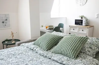 Un ou plusieurs lits dans un hébergement de l'établissement MonSéjourCosy - Le Cottage - Studio - Cosy - Netflix