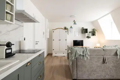 Cuisine ou kitchenette dans l'établissement MonSéjourCosy - Le Cottage - Studio - Cosy - Netflix