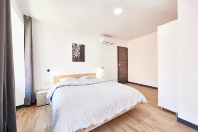 Un ou plusieurs lits dans un hébergement de l'établissement TH 201 Appartement F3 spacieux 1 à 5 personnes au 2ème étage