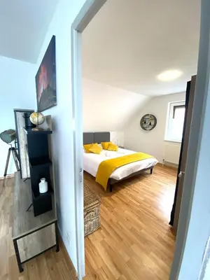 Un ou plusieurs lits dans un hébergement de l'établissement Grand T3, 2 chambres, jardin au calme - Gîte du Photographe