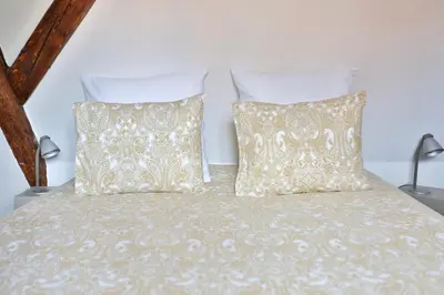 Un ou plusieurs lits dans un hébergement de l'établissement Duplex 3 châteaux