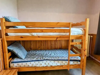 Un ou plusieurs lits dans un hébergement de l'établissement Appartement charmant au pied du Plateau des Mille Etangs à Mélisey - FR-1-583-425