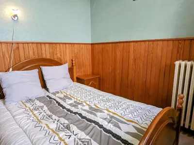 Un ou plusieurs lits dans un hébergement de l'établissement Appartement charmant au pied du Plateau des Mille Etangs à Mélisey - FR-1-583-425