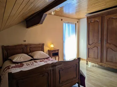 Un ou plusieurs lits dans un hébergement de l'établissement Gîte chaleureux dans les Vosges avec cheminée - FR-1-583-437