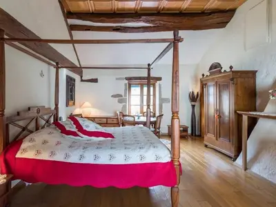 Un ou plusieurs lits dans un hébergement de l'établissement Charme Authentique au Moulin de Saphoz avec Grand Jardin - FR-1-583-499