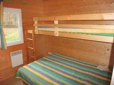 Un ou plusieurs lits dans un hébergement de l'établissement Chalet Edelweiss au cœur de la nature vosgienne - FR-1-583-441