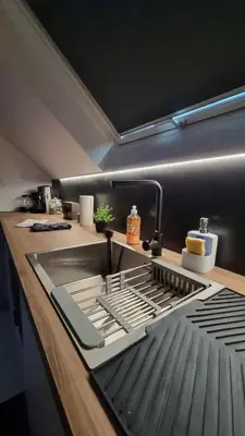 Cuisine ou kitchenette dans l'établissement Sur la savoureuse - Le 54