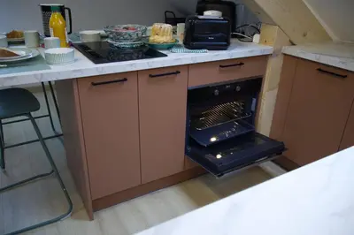 Cuisine ou kitchenette dans l'établissement Azalée cocooning appartement