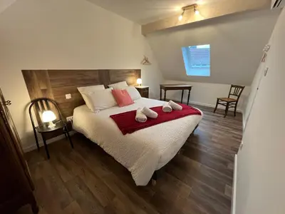 Un ou plusieurs lits dans un hébergement de l'établissement La Cour de Mamama Appartement 5