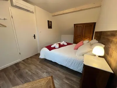 Un ou plusieurs lits dans un hébergement de l'établissement La Cour de Mamama Appartement 5