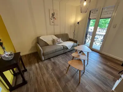 Coin salon dans l'établissement La Cour de Mamama Appartement 5