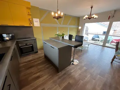 Cuisine ou kitchenette dans l'établissement La Cour de Mamama Appartement 6
