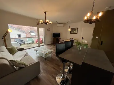 Coin salon dans l'établissement La Cour de Mamama Appartement 6