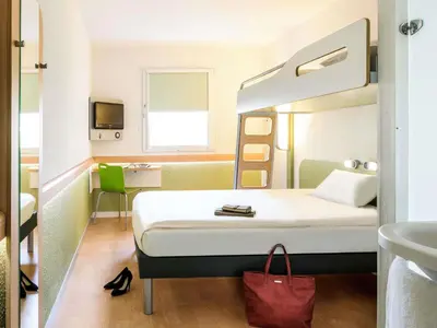 Un ou plusieurs lits dans un hébergement de l'établissement Ibis Budget Montbéliard