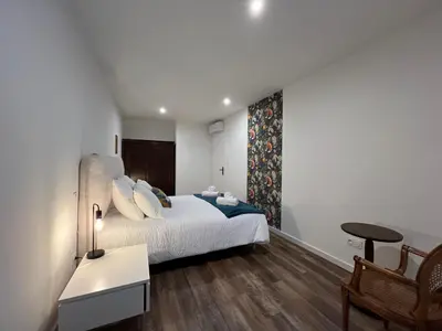 Un ou plusieurs lits dans un hébergement de l'établissement La Cour de Mamama Appartement 7